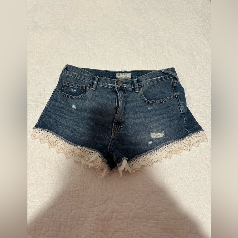 Free People size 30 jean shorts trimmed with lace